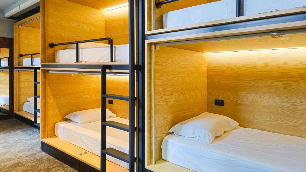A repeated fitted cabin seen from a corridor door